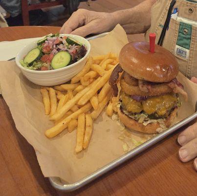 Outlaw burger with additional side salad (+$2 for salad as of November 2025)