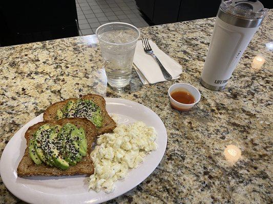 Avocado Toast with egg whites and hot sauce coffee in tumbler lifetime