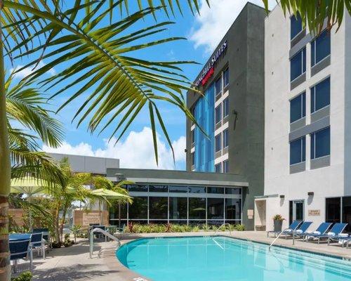 view of the pool and the front of the hotel