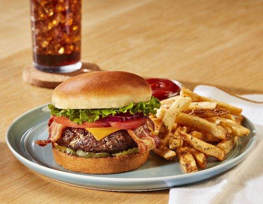 One of our most popular signature dishes, our All-American Burger, featured with our House Seasoned Fries