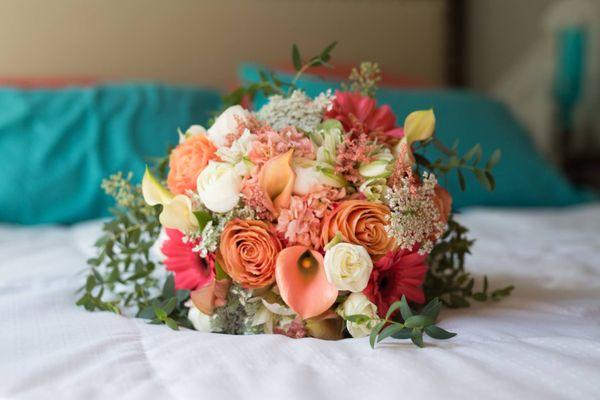 Coral, peach and cream are a beautiful combination for a bridal bouquet