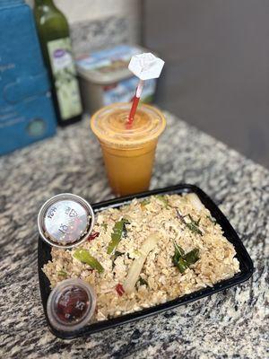 Kow Pad Kra Pow. Basil fried rice with chicken and a Thai iced tea. Oh and my favorite Thai chili fish sauce.