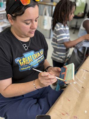 Painting make and take sign at Keppel & Kismet.