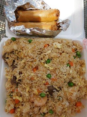 Combination fried rice with egg rolls