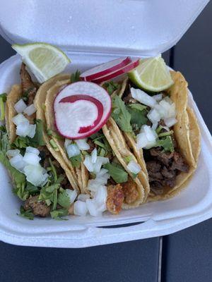 Asada, pastor, and chicken (pollo) tacos served with fresh, handmade tortillas.