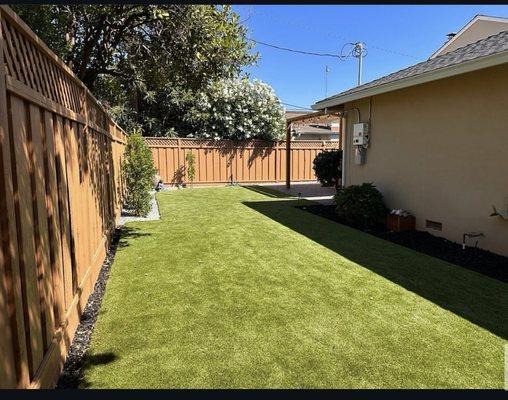 Turf & Paver Perfection - Lush artificial turf and sleek pavers for a modern, low-maintenance yard!  #LuxuryLandscaping