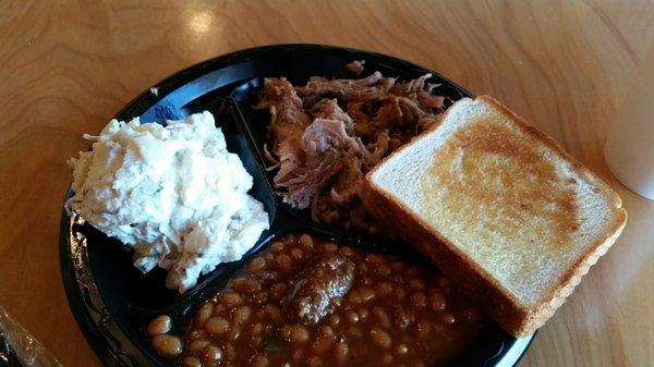 Pork plate with potato salad and beans