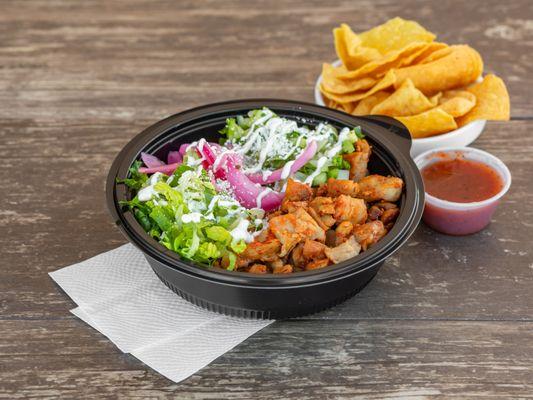 Adobo chicken, whole beans, chipotle rice, lettuce, sour cream and curtido