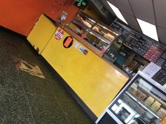 The counter area. Place is actually neat considering it's location(EV). They even use a microphone to call orders to the back!