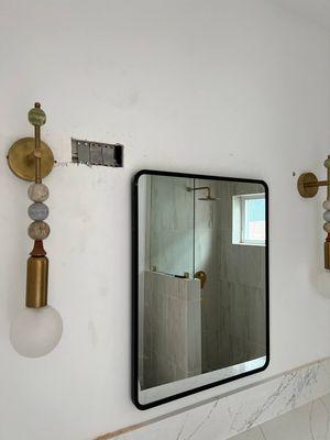 Sconce wiring had to be adjusted, wall left open by electrician.