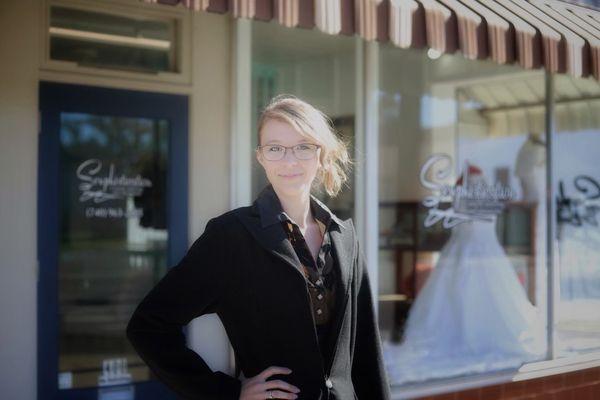 The owner Esther, in front of her store.