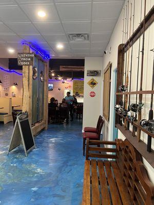 Entrance with a cute bench for waiting as well as some outside