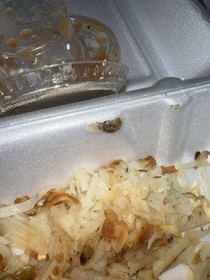 Hash brown burnt hole in plastic yuck Breakfast special / Have you heard of foil?