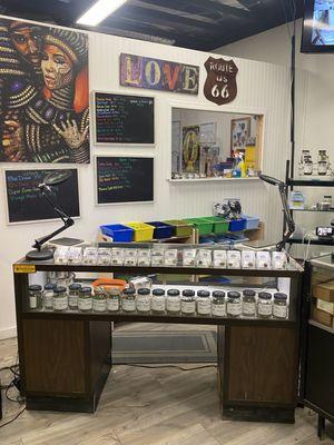 Display consisting of our 25-31 strains of indica, hybrid, and sativa flower.