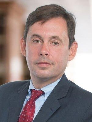 John P. Comerford - Senior Partner