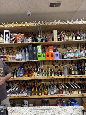 Name brand liquors behind the counter