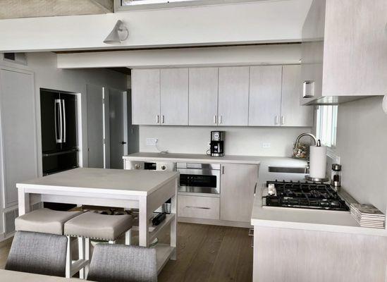 Slab door style cabinets were chosen for the job. We also offer Shaker door style for the cabinets!