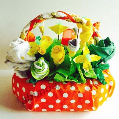 Basket of love!!! This unisex gift basket is filled with items for a new born. One sees, socks, feeding bottle, bib and lots more...