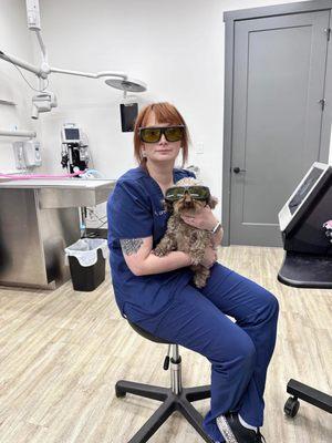 Kait, Veterinary Technician preparing to perform laser therapy on a patient.