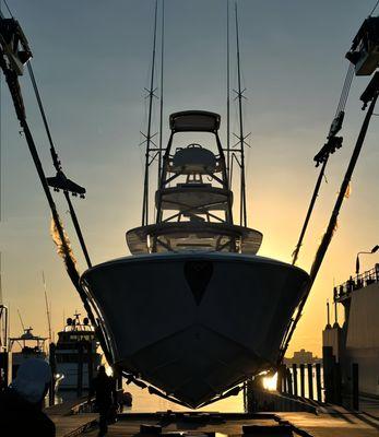 Sparks 46 Center Console at sunrise in West Palm Beach at hall out slip in slings