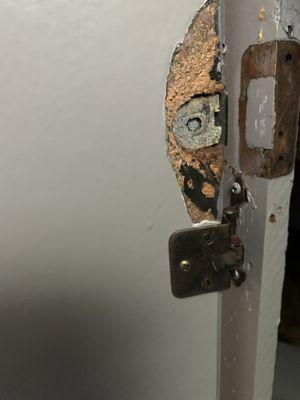 Rotting door hinge at move in