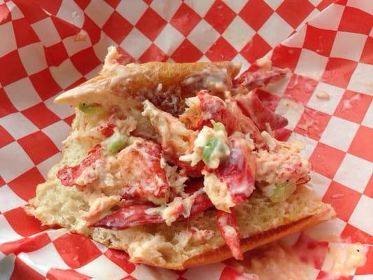 Mostly eaten lobster roll topped with lobster bisque