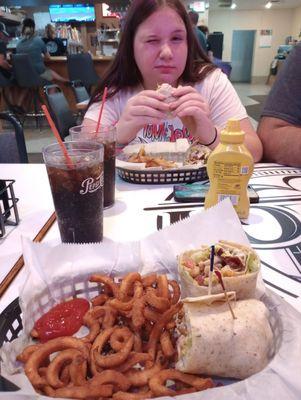 Sitting at the table enjoying our meal!