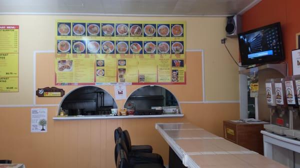 The sit down bar style tables an front order area