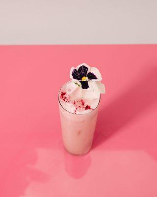 Signature Drink: Moon Indigo- Hibiscus distilled coffee with coconut cream, strawberry thai basil cordial and rose water