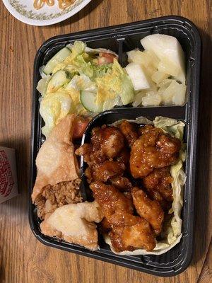 Dinner plate with general Tso's chicken, crab rangoon, pork fried rice and a salad plus fruit!