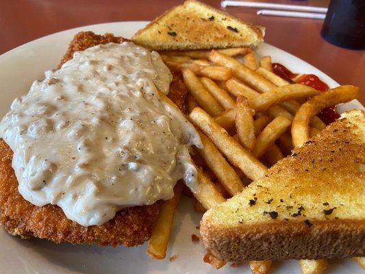 Country Fried chicken topped with sausage gravy, fries & garlic toast