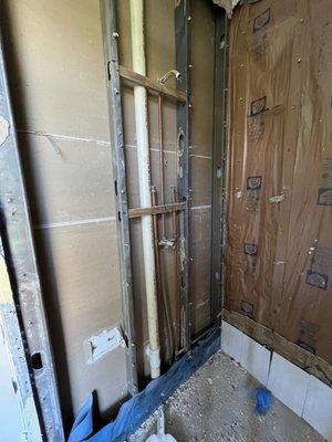 Shower demolition... plumbing to be extended, adding a three way/sharing valve.