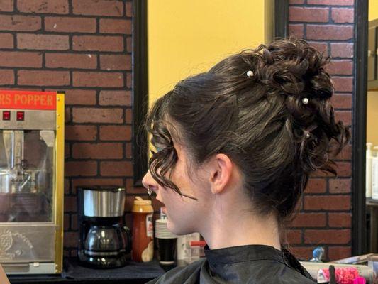 Messy updo hairstyle done by Judy