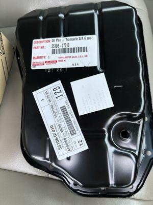 This is the new transmission pan that they damaged the sides of it after installing it