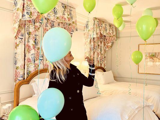 The room was filled with green balloons with little bows! LIFE SAVER !