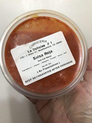 Spicy red salsa really good flavor and got a good kick to it
