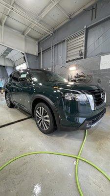 2022 Nissan Frontier Platinum in Obsidian Green Pearl with Super Black roof