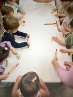 Our 2-year-old class practicing the art of being chefs in the kitchen, utilizing multiple senses at once in our sensory learning environment