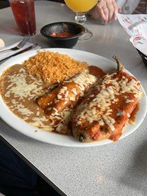 Chicken Enchilada, stuffed pepper (cheese and spinach), rice and refried beans.