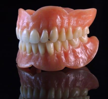High-impact esthetic dentures from Udell Dental Laboratory.