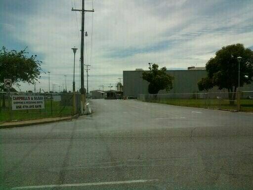 The factory entrance- pull up to the security guard shack and make a right. Follow the building and you'll see the store.