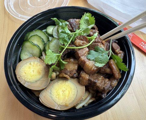 Pork noodle bowl. BEST if mixed well with sauce you don't see in picture because it's underneath the ingredients.