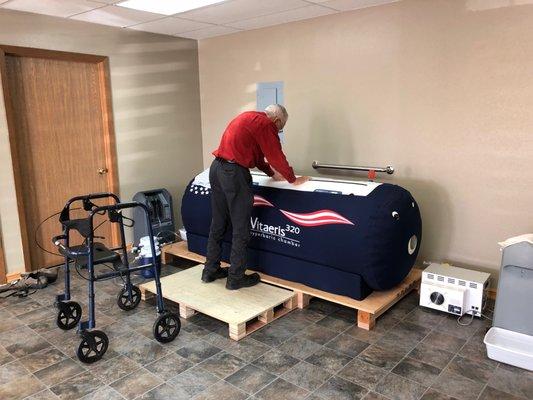 Dr. Brodie operating a chamber.