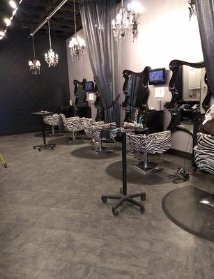 Fun and whimsical atmosphere accented with Marilyn Monroe pictures and quotes. Big city look with a small town feel.