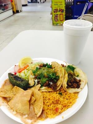 #1 two carne asada tacos with rice, beans, lettuce, tomato & chips