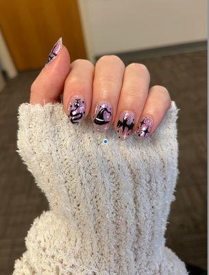 Glittery purple halloween nail design