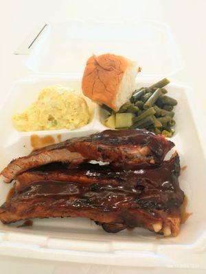 BBQ ribs, green beans, mashed potatoes and dinner roll