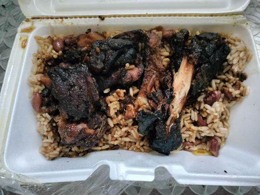Jerk chicken and beef with rice and peas