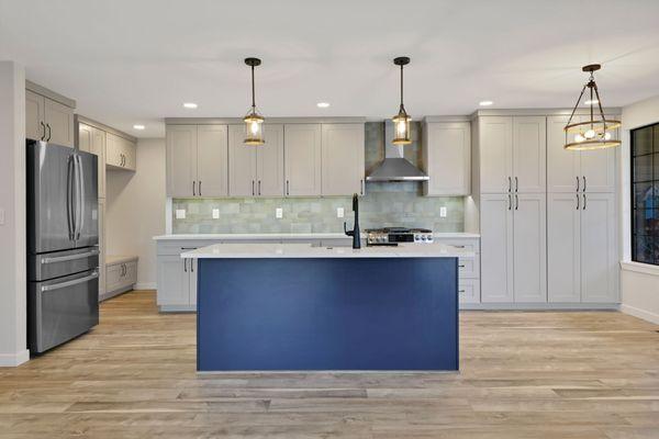 Interior kitchen remodel with custom built-ins, open concept kitchen design, flooring and lighting replacement. Home remodel by Nordic.