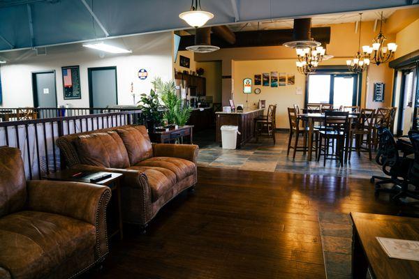 Rooftop mezzanine lounge with casual seating, fireplace and bar.